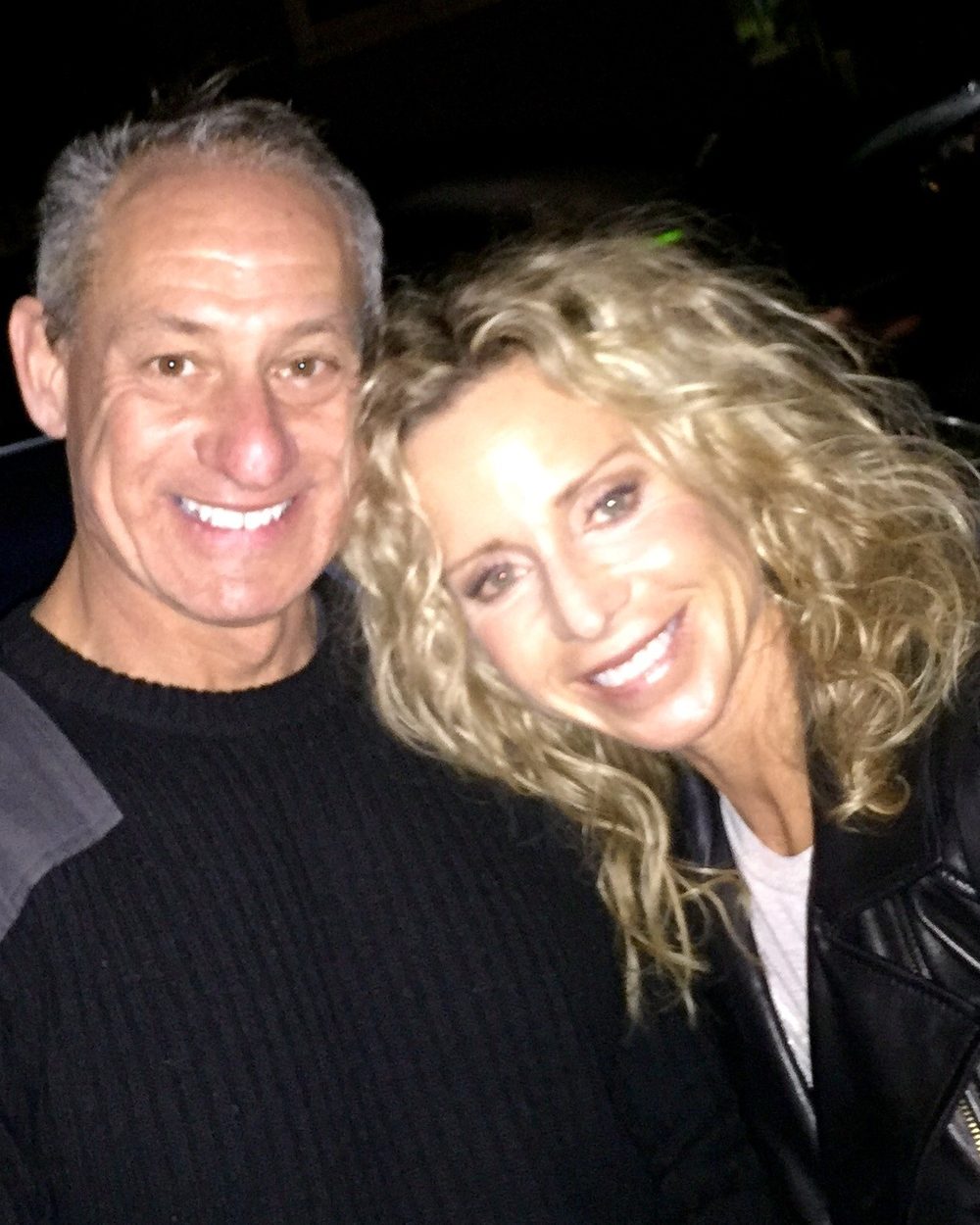 Ben and Loree close together on a night out, early in their time together